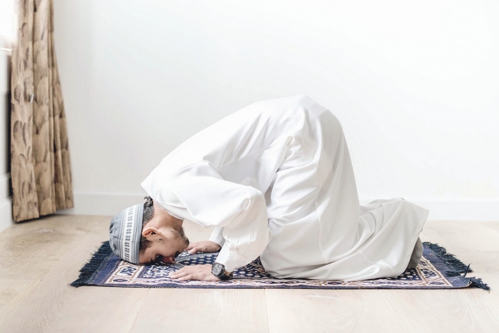 Why do Muslims pray on a mat?